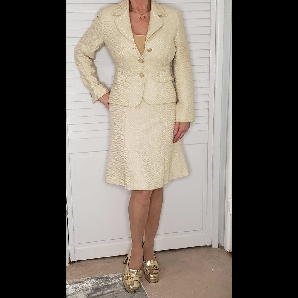 Woman's cream and gold suit